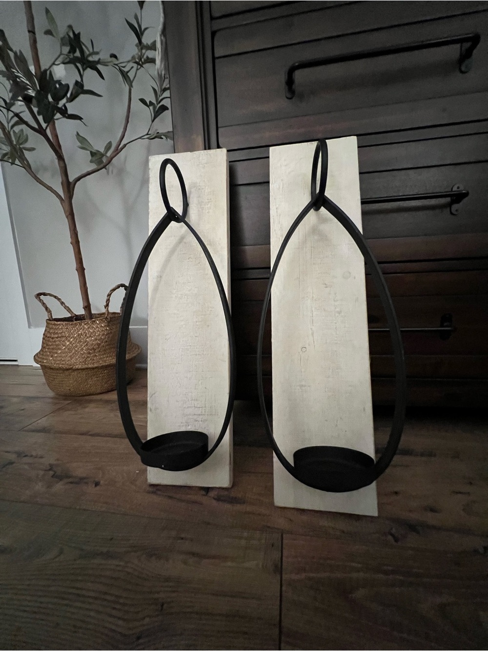 Set of TWO Black Iron Wall Sconces with off White Wood Backing